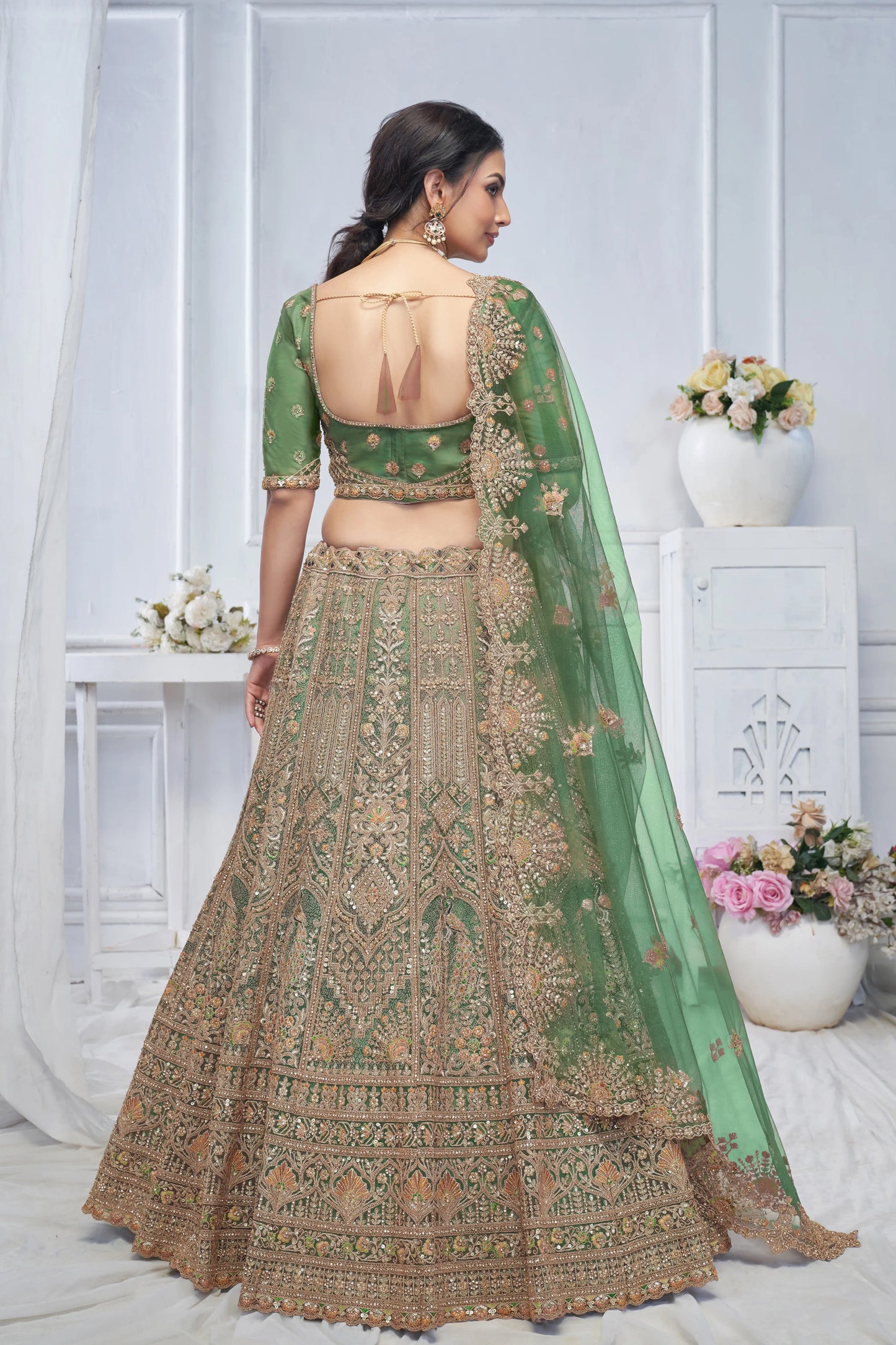 Royal Grandeur bridal  Green Mehendi Lehenga with Paisley and Peacock Motifs & Heavy Embroidery