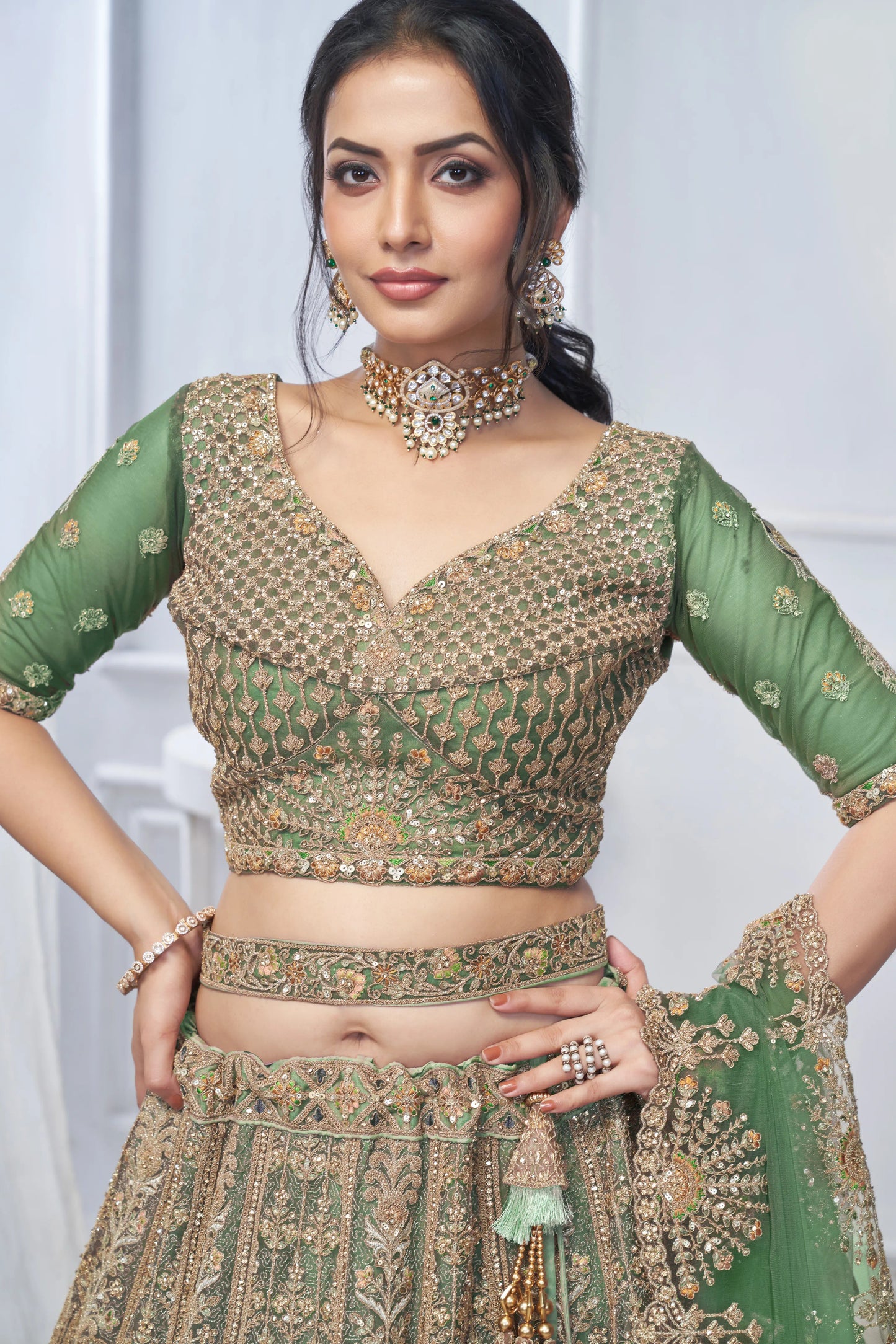 Royal Grandeur bridal  Green Mehendi Lehenga with Paisley and Peacock Motifs & Heavy Embroidery