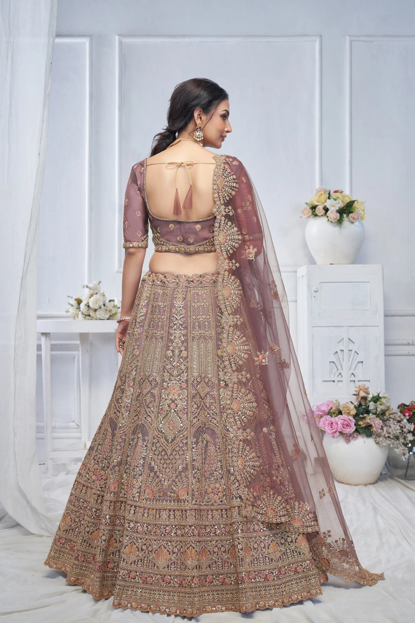 Royal Grandeur bridal  Purple Soft Net Lehenga with Paisley and Peacock Motifs & Heavy Embroidery