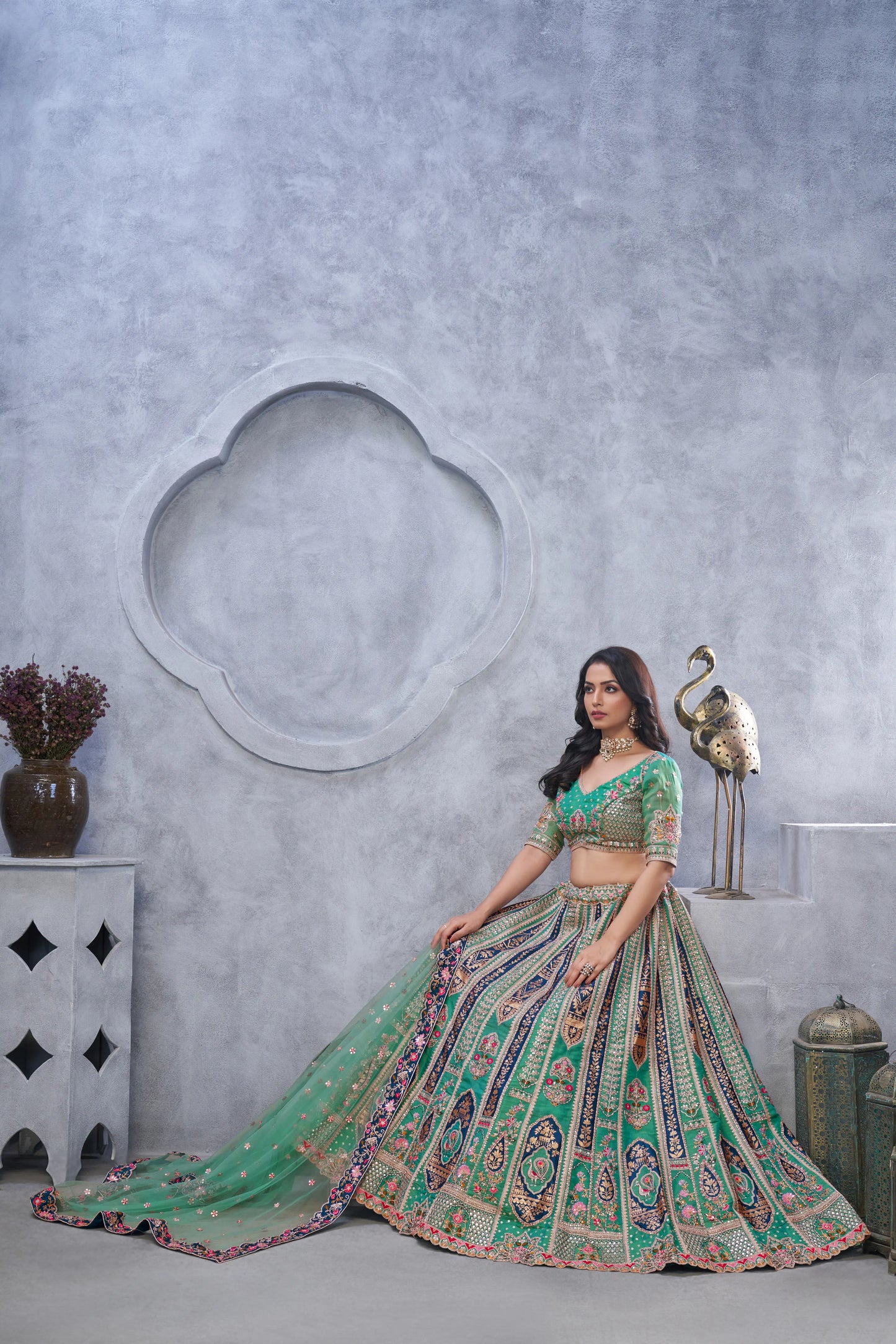 Organza Silk Intricate Paisley Motifs Traditional Embroidered Wedding Lehenga Choli In Green Color With Soft Net Dupatta