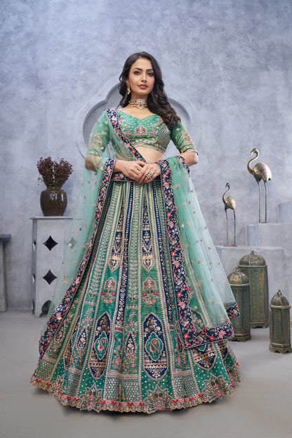 Organza Silk Intricate Paisley Motifs Traditional Embroidered Wedding Lehenga Choli In Green Color With Soft Net Dupatta