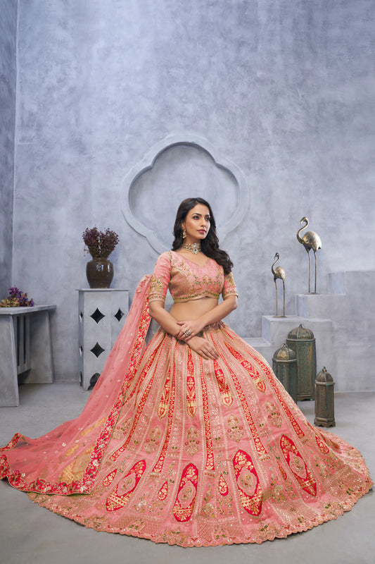 Organza Silk Intricate Paisley Motifs Traditional Embroidered Wedding Lehenga Choli In Pink color With Soft Net Dupatta