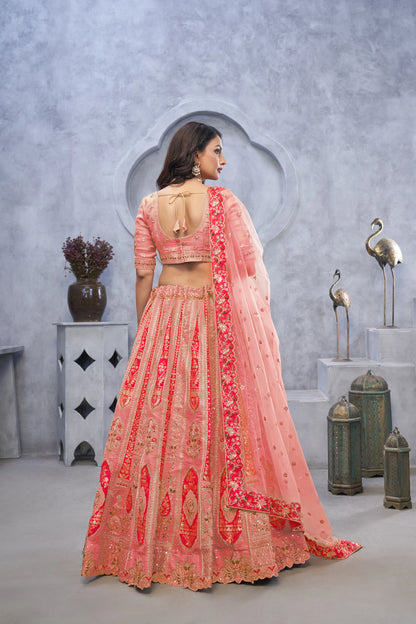 Organza Silk Intricate Paisley Motifs Traditional Embroidered Wedding Lehenga Choli In Pink color With Soft Net Dupatta