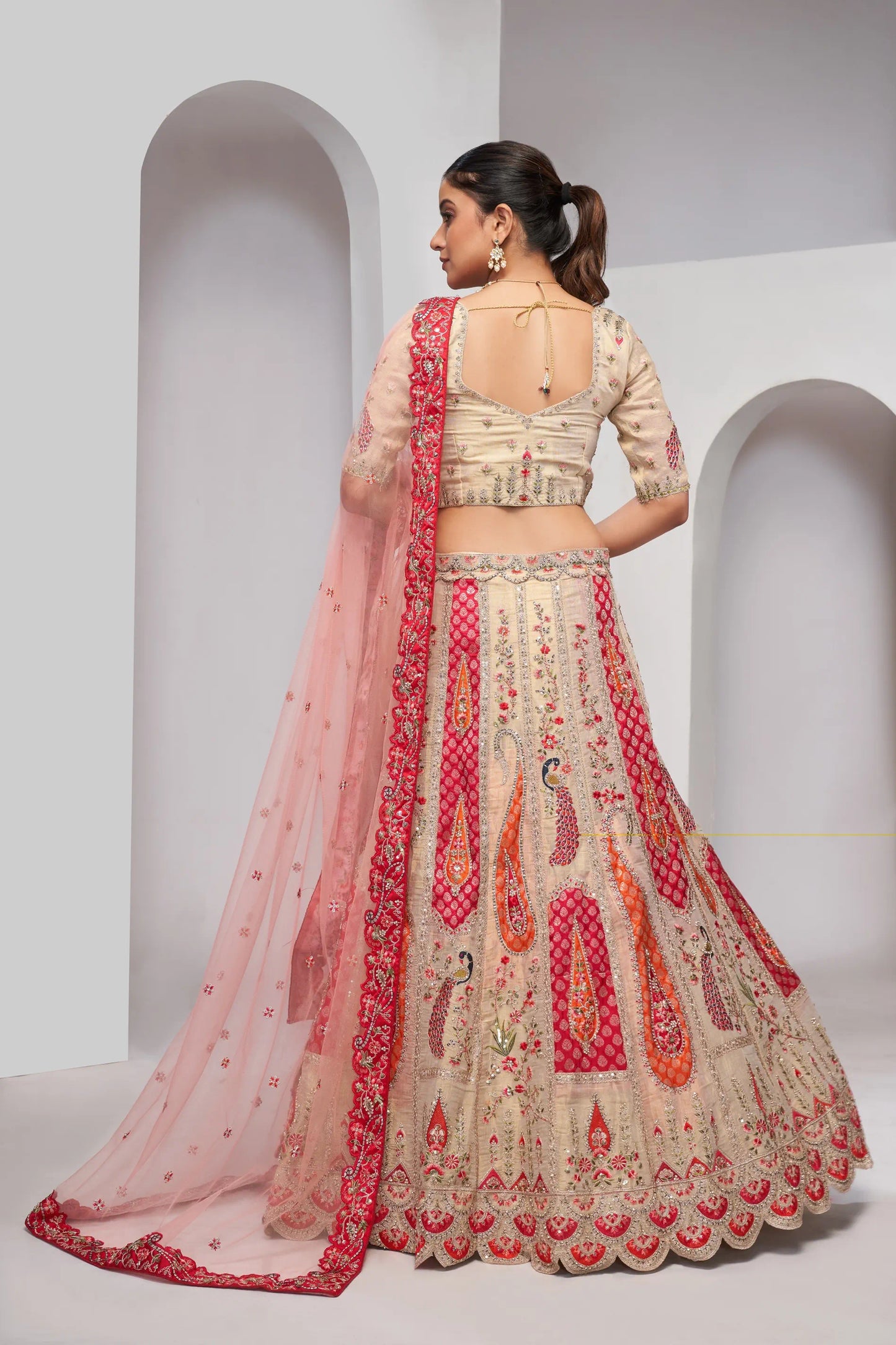 Paisely motifs beautiful peacock embroidered in Bright Cream bridal lehenga choli set